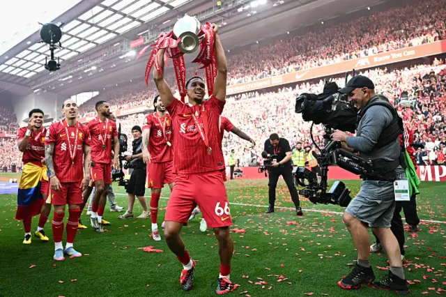 Trent Alexander-Arnold celebrates with the Premier League trophy