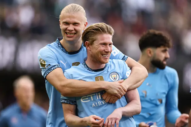 Erling Haaland of Manchester City hugs Kevin De Bruyne