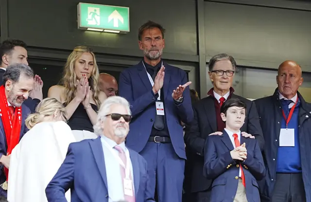 Former Liverpool manager Jurgen Klopp (centre) and Liverpool owner John Henry (second right) in the stands before the Premier League match at Anfield, Liverpool.