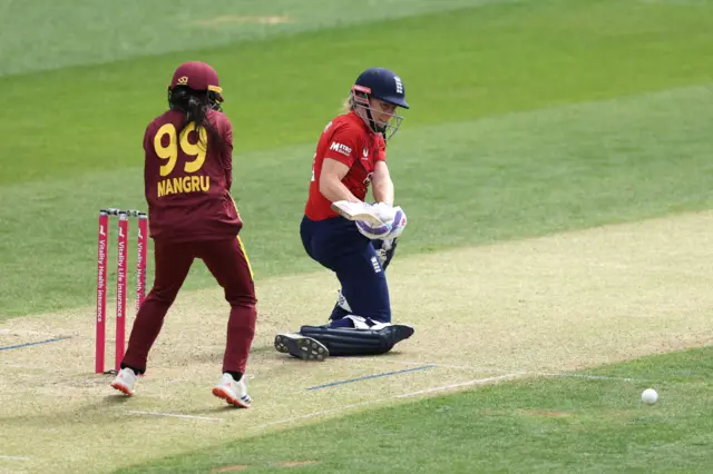Heather Knight plays a shot