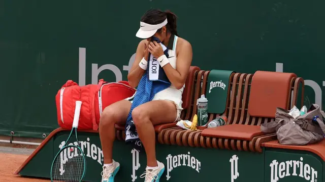Emma Raducanu sits on her bench at the change of ends