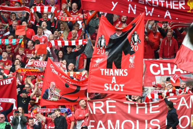Liverpool supporters display flags and banners at Anfield
