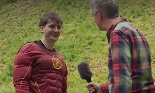 Michael dressed in The Flash suit being interviewed by Steve Knibbs