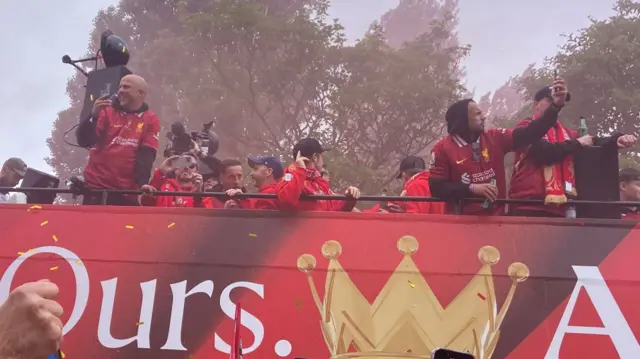 Arne Slot films the crowd from top of parade bus