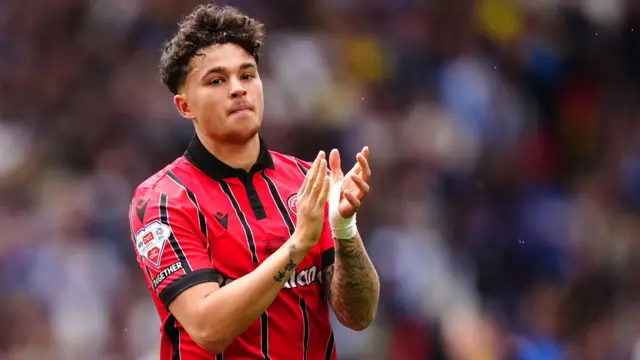 Walsall's Alfie Chang applauds