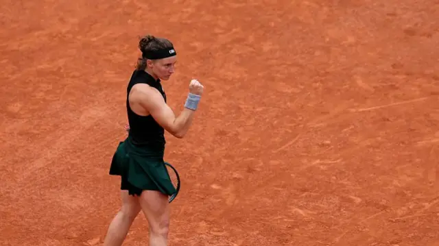 Carole Monnet reacts after a point