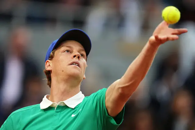 Italy's Jannik Sinner serves to France's Arthur Rinderknech