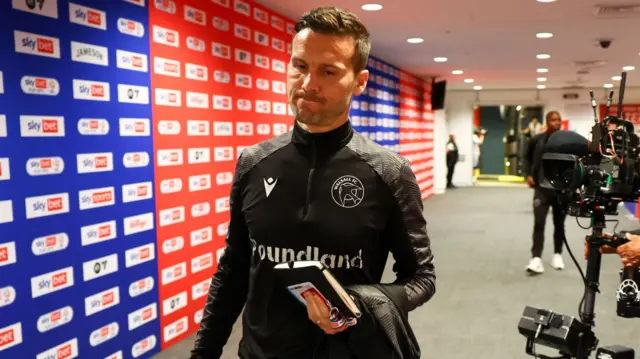 Walsall boss Mat Sadler arrives at Wembley