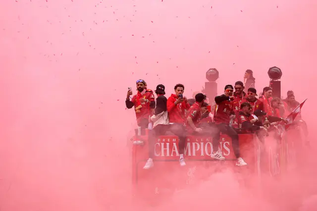 At times you could just about make out the Liverpool team as red smoke engulfed the buses