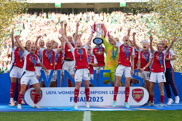 Arsenal celebrating with the Women's Champions League trophy