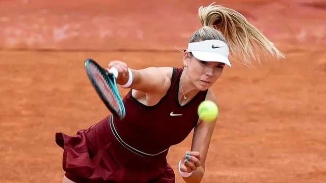 Katie Boulter serves to France's Carole Monnet