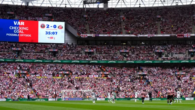 The screen at Wembley showing a VAR check is ongoing between Sheffield United and Sunderland