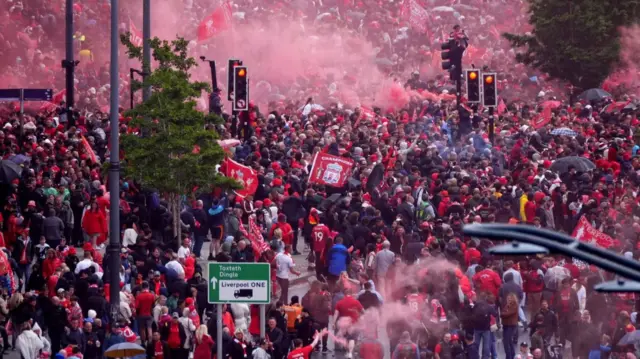Crowds of people in red shirts