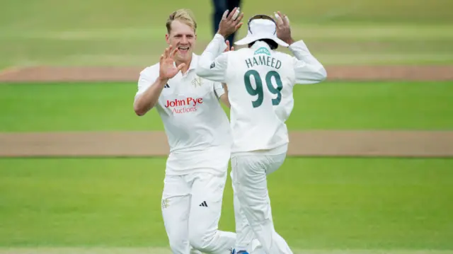 Dillon Pennington celebrates wicket with captain Haseeb Hameed