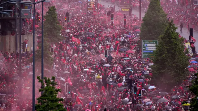 Crowds gather near Liverpool Waterfront ahead of the open-top bus parade