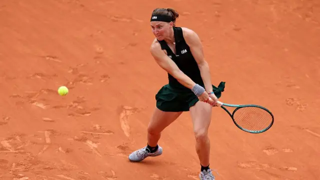 Carole Monnet plays a backhand