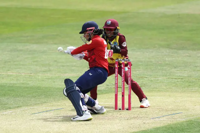 England's Sophia Dunkley (left) is caught out by West Indies' Mandy Mangru during the Third Women's International T20 match at The Cloud County Ground, Chelmsford