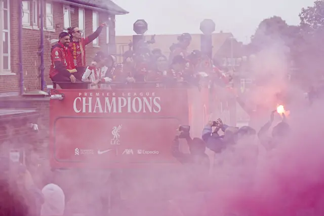 Liverpool's Mohamed Salah (left), Kostas Tsimikas (second left) and team-mates on the team bus during the Premier League winners parade in Liverpool.