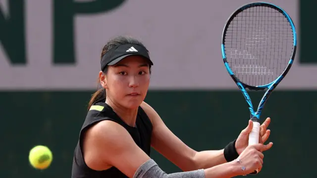 Wang Xinyu plays a backhand
