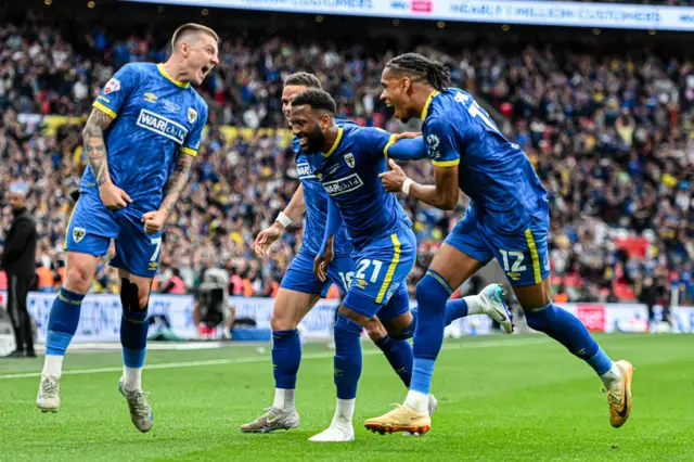 Myles Hippolyte celebrates with his Wimbledon team-mates