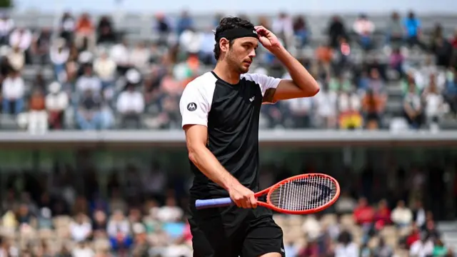 Taylor Fritz reacts after defeat