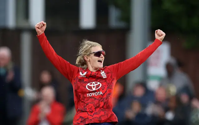 Charlie Dean celebrates the wicket of Realeanna Grimmond