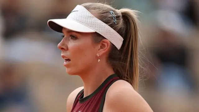 Katie Boulter looks on during the first-round match