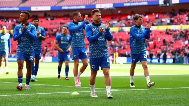 AFC Wimbledon players warming up
