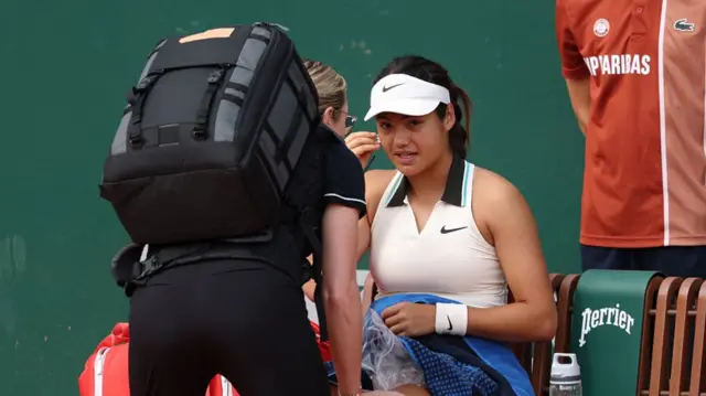 Emma Raducanu receives treatment