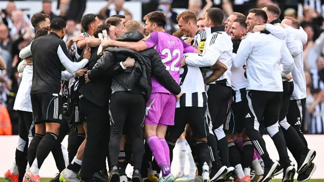 Newcastle players and staff celebrate