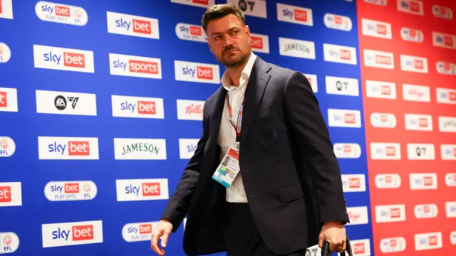 AFC Wimbledon boss Johnnie Jackson arrives at Wembley