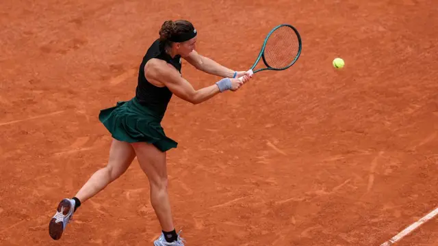 Carole Monnet plays a shot