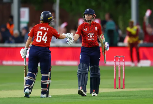 England's Heather Knight celebrates with Alice Capsey after reaching her half-century