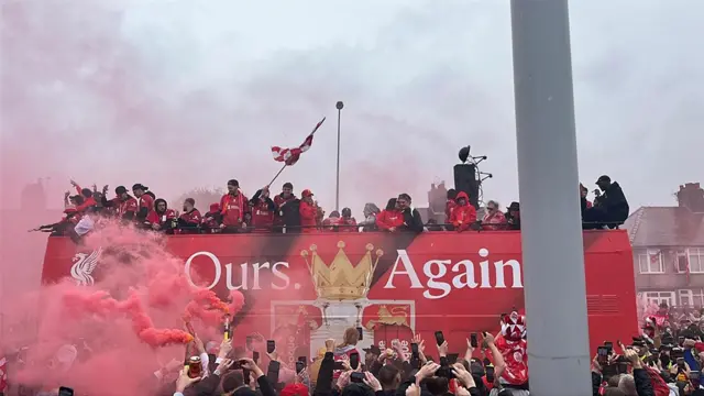 Liverpool team on the top deck of the open-top bus in the victory parade