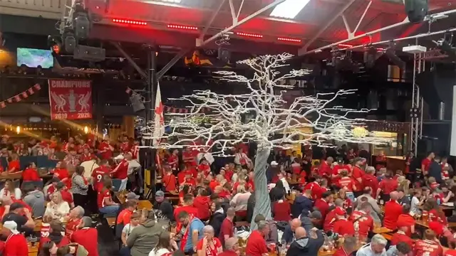 Liverpool fans keeping dry in Blackstock market