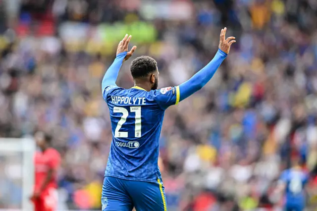 Myles Hippolyte celebrates