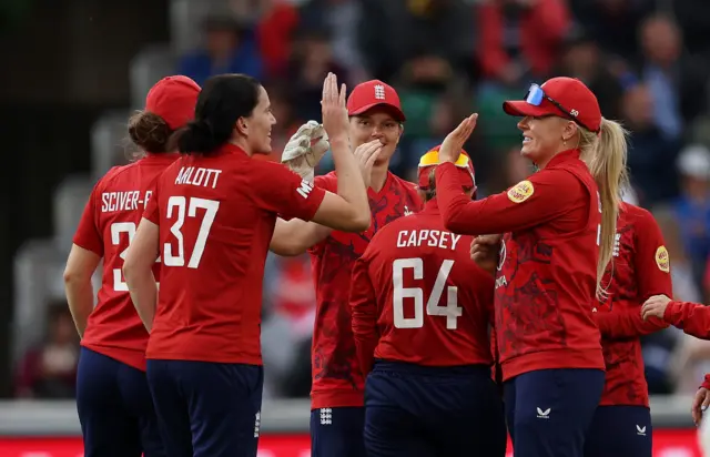Em Arlott and England celebrate a wicket