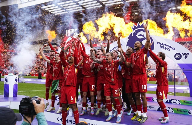 Liverpool celebrate lifting the Premier League trophy