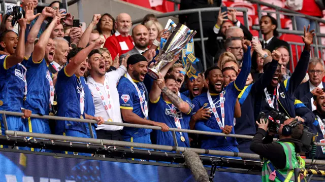 Wimbledon lift the League Two play-off final trophy