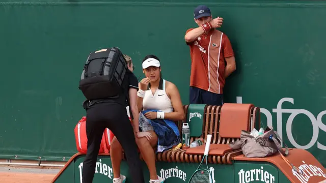Emma Raducanu of Great Britain receives treatment