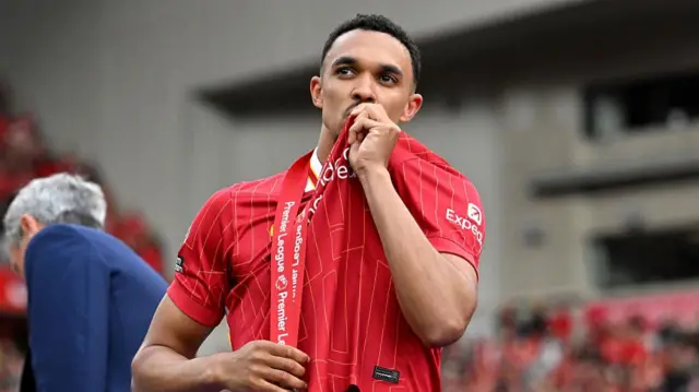 Trent Alexander-Arnold kisses Liverpool badge