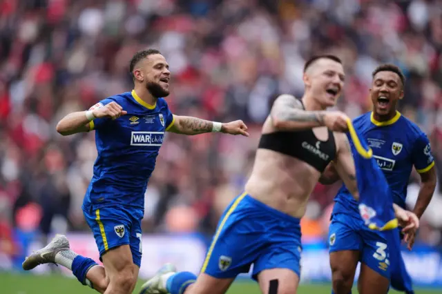 Wimbledon players celebrate at full-time