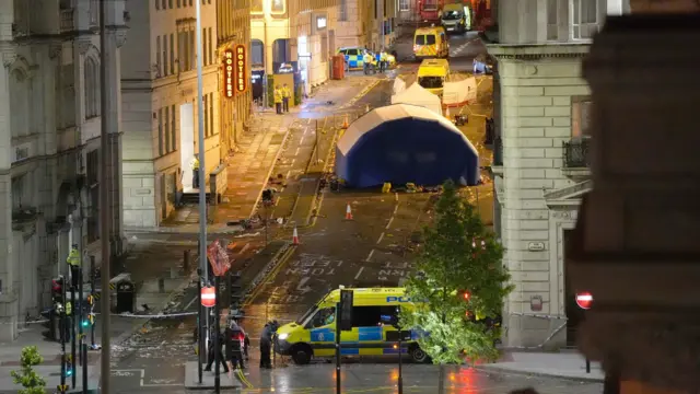 Showing Water Street with tents and police tape up