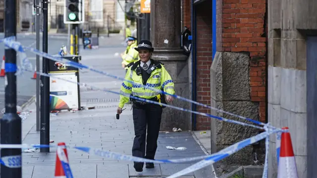 Description A police officer at the scene in Water Street near the Liver Building in Liverpool after a 53-year-old white British man was arrested when a car ploughed into a crowd of people during Liverpool FC's Premier League victory parade.