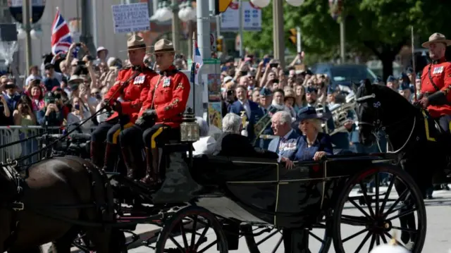 The King and Queen in their coach