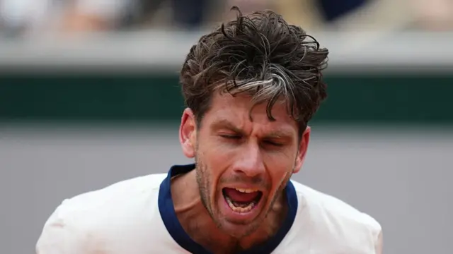 Cameron Norrie reacts as he plays against Daniil Medvedev