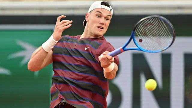 Jack Draper hits a forehand