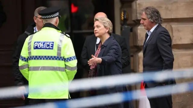Yvetter Cooper visiting Liverpool with police officers