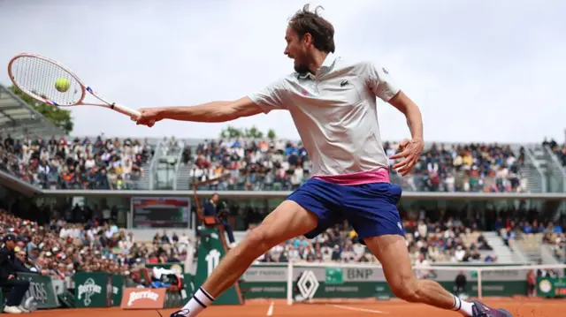 Daniil Medvedev plays a backhand