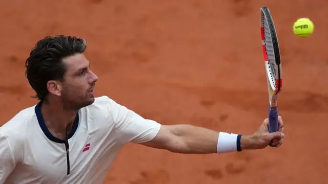 Cameron Norrie plays a backhand return